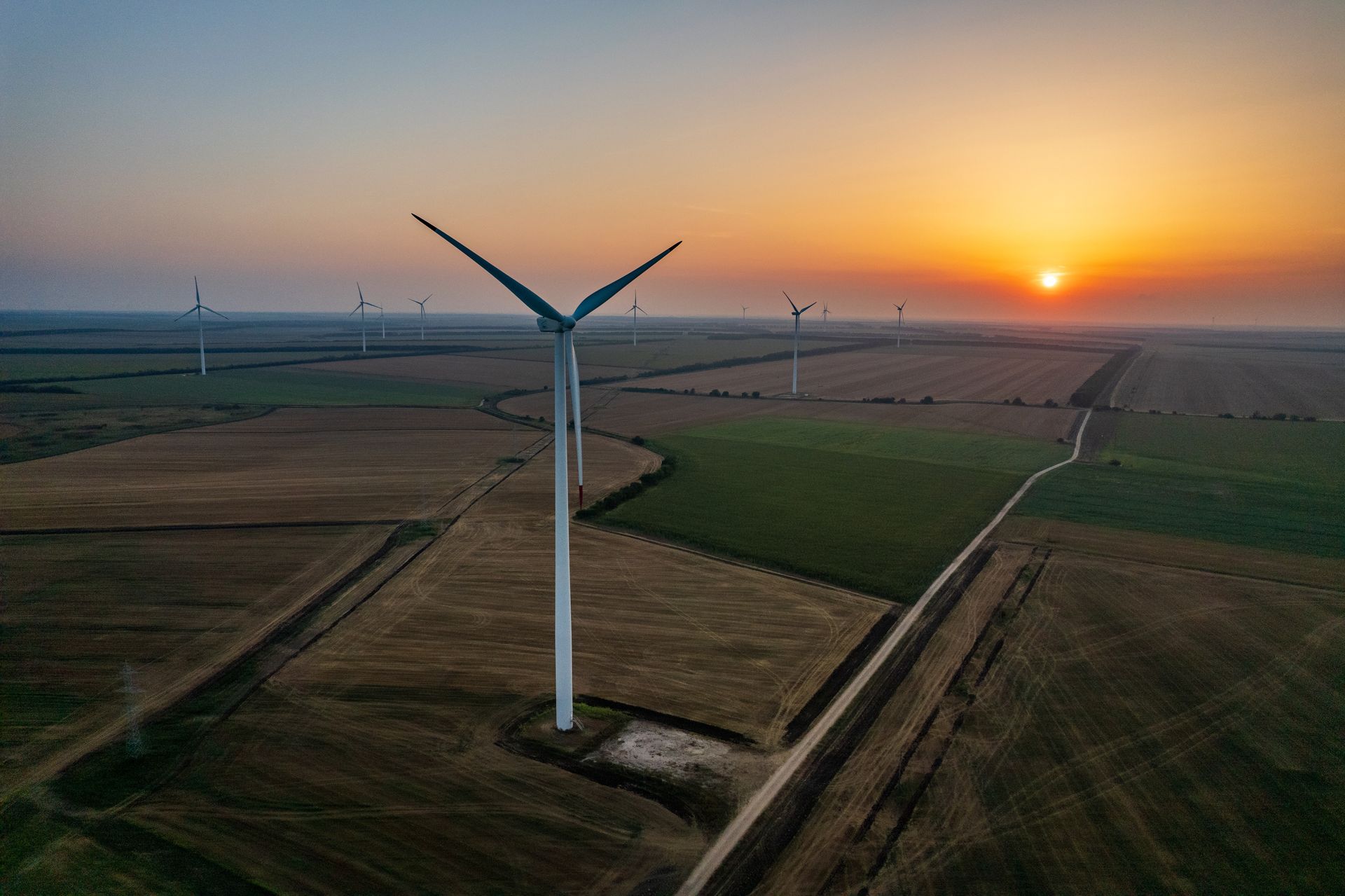 Aerial view of a wind farm at golden hour